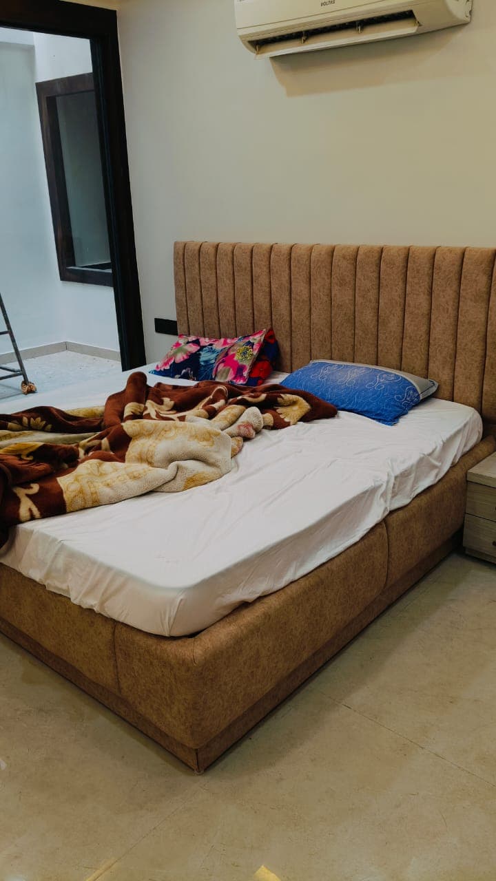 Custom double bed with wooden frame and modern design