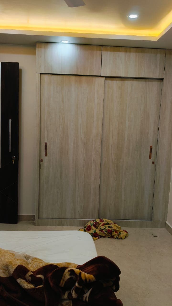Elegant wardrobe with sliding doors and interior organization